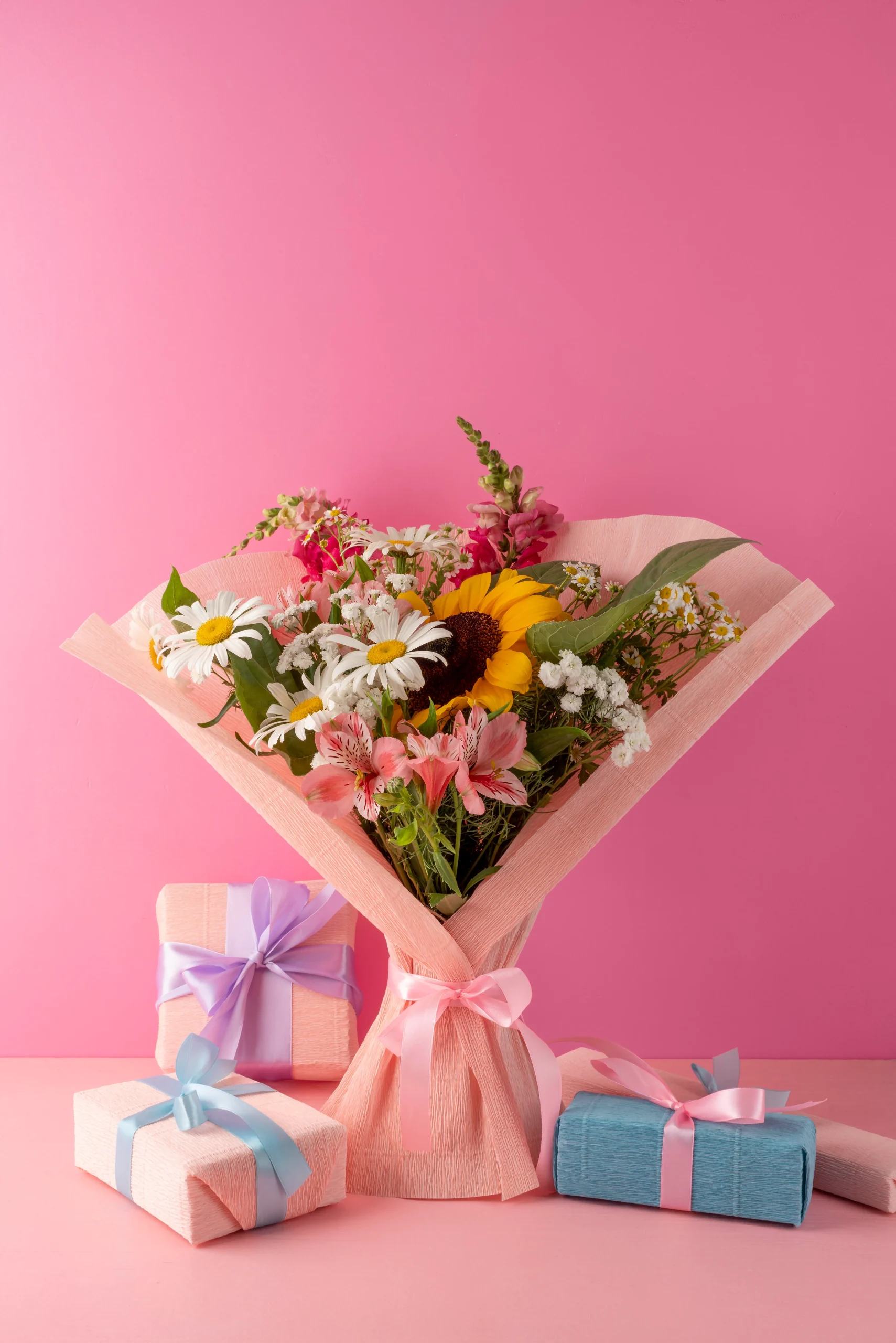 Colourful flower bouquet with gifts